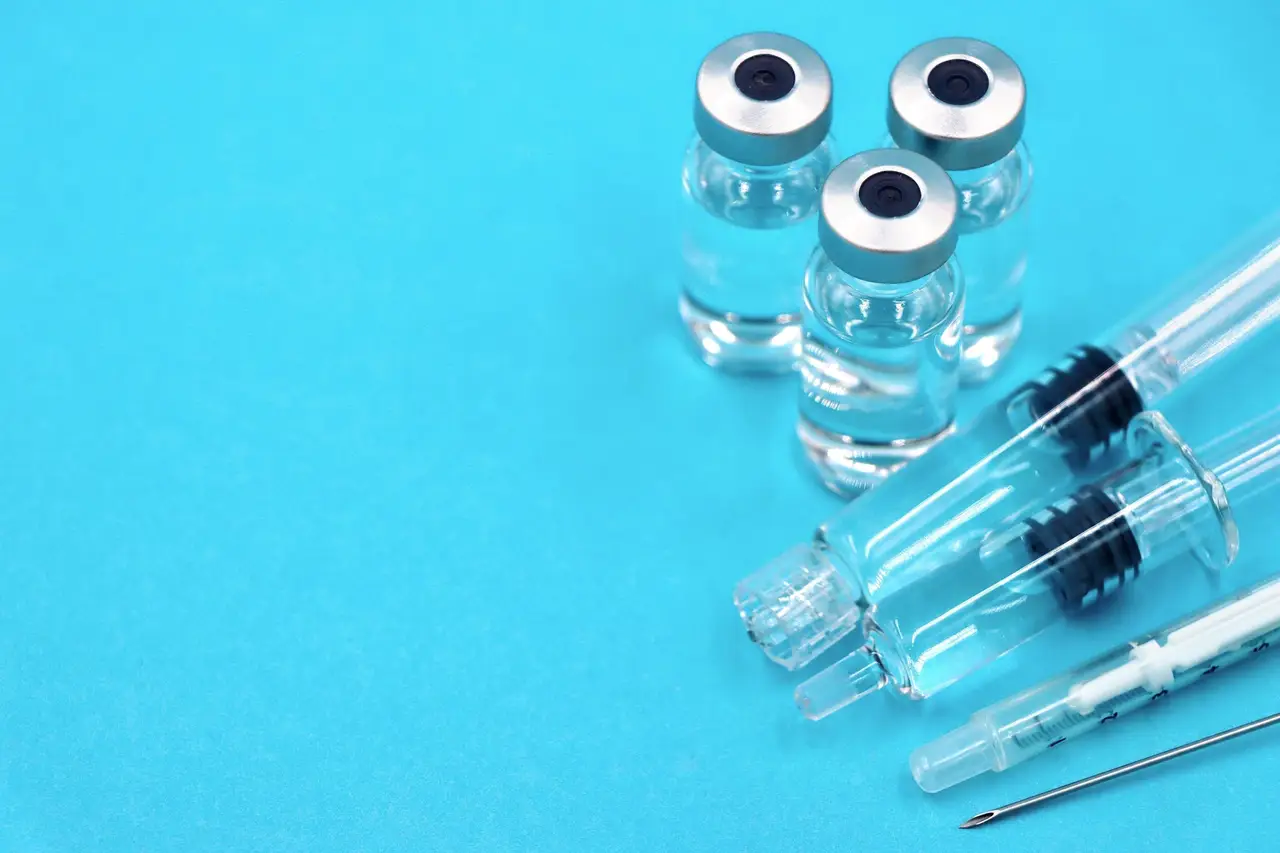 Vaccination Equipment on Blue Background